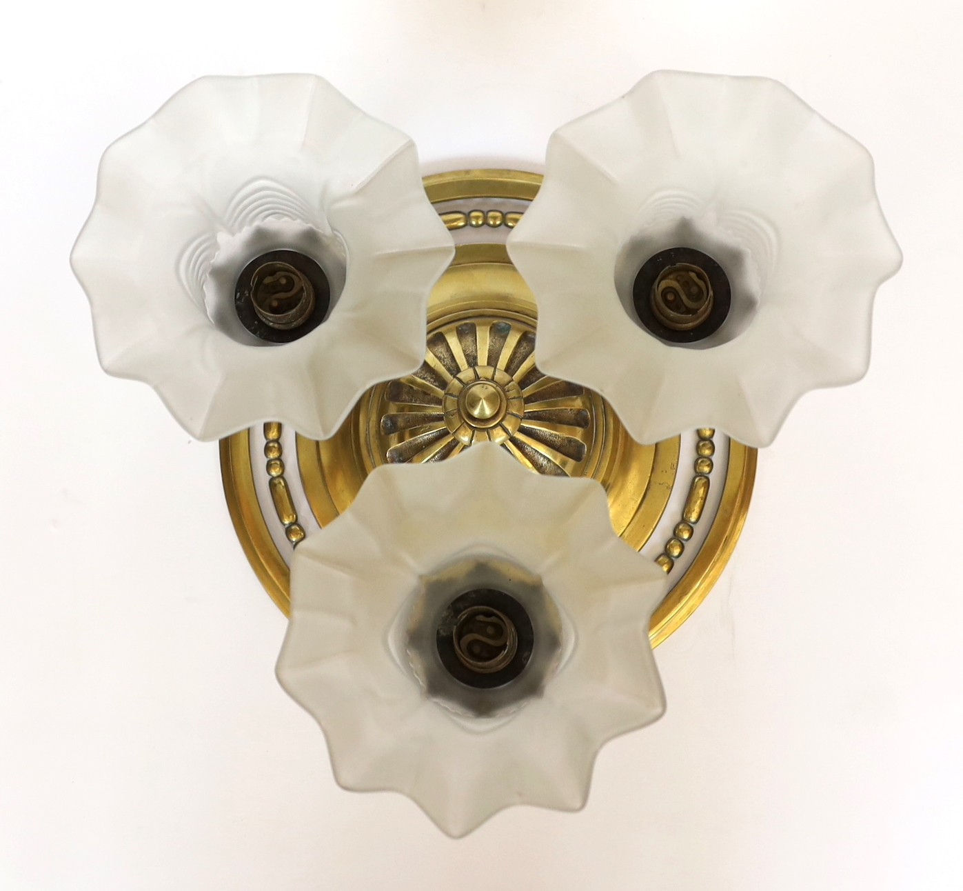 A 1920s French bronze ceiling light with three frosted glass shades, height 20cm. width 32cm
